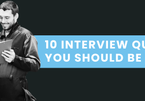 Automotive shop manager interviewing a technician candidate in a modern repair facility